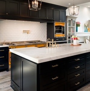 Another great example of a black and white kitchen with silver