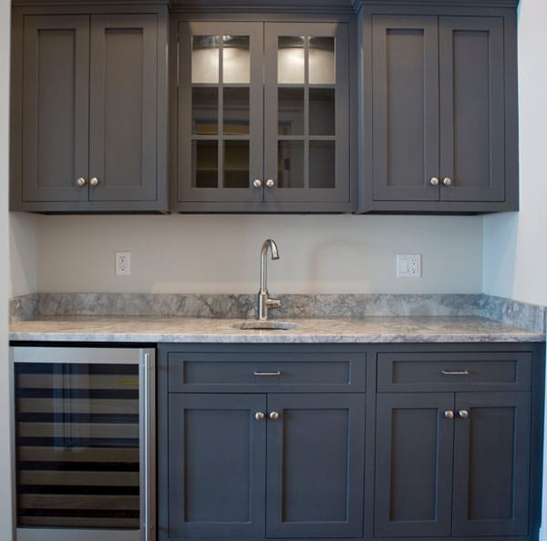 Dark cabinets with store granite countertops